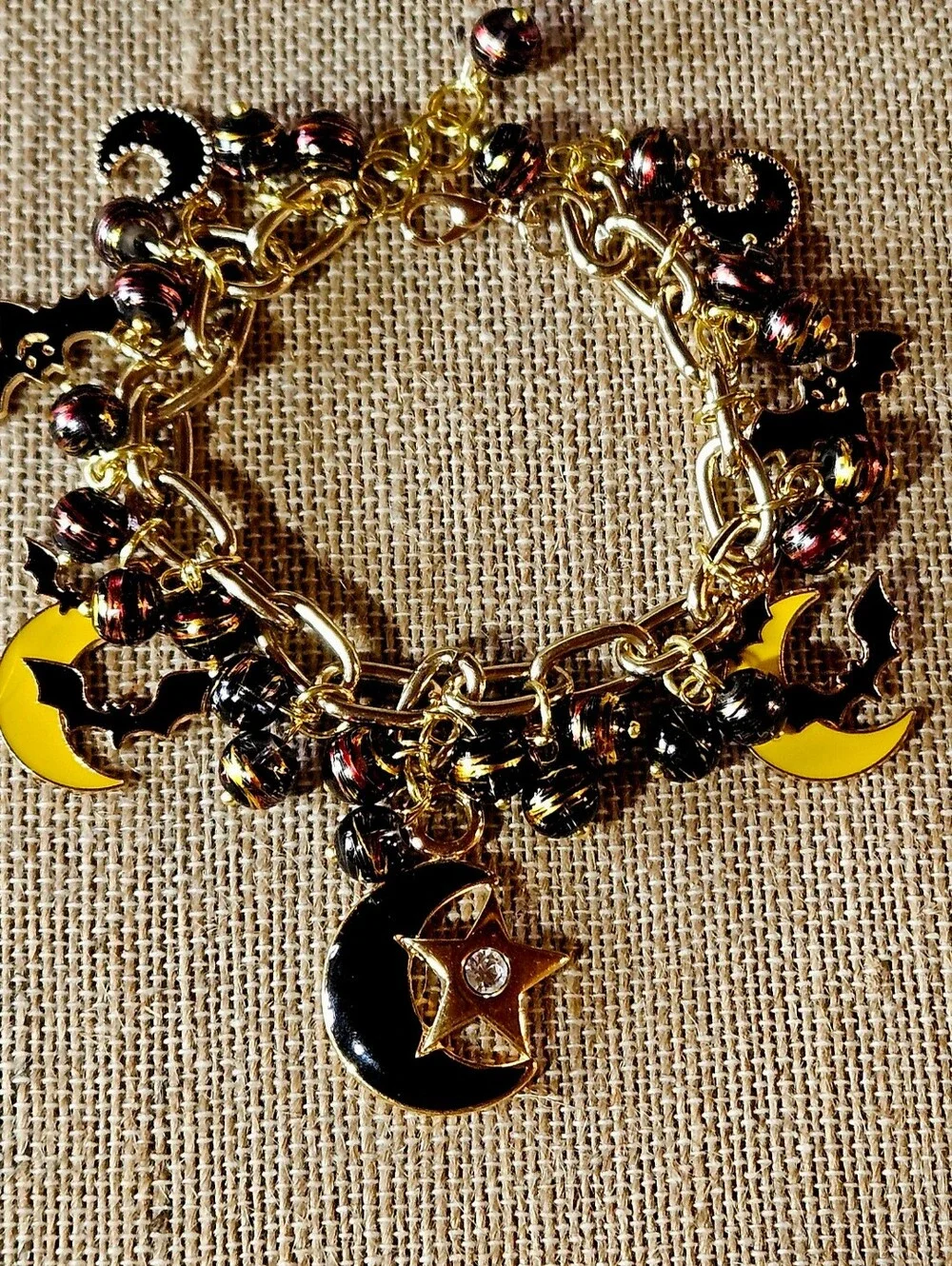 Gold-Tone Moon, Stars And Black Bats Charm Bracelet in Black and Yellow - Picture 8 of 8